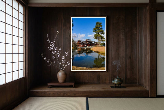 Byōdō-in Phoenix Hall Reflections, Uji, framed in a tea-ceremony tokonoma alcove — dark cedar wall, tatami floor, bronze incense burner, ikebana cherry blossom, dark wood frame. — Two Fat Bunnies.