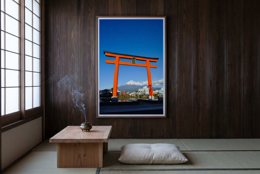 Mt Fuji Through the Torii Gate – Shizuoka, framed on a dark cedar wall in a Japanese tea ceremony room — tatami floor, low cedar table, zabuton cushion, bronze incense burner, dark wood frame. — Two Fat Bunnies.