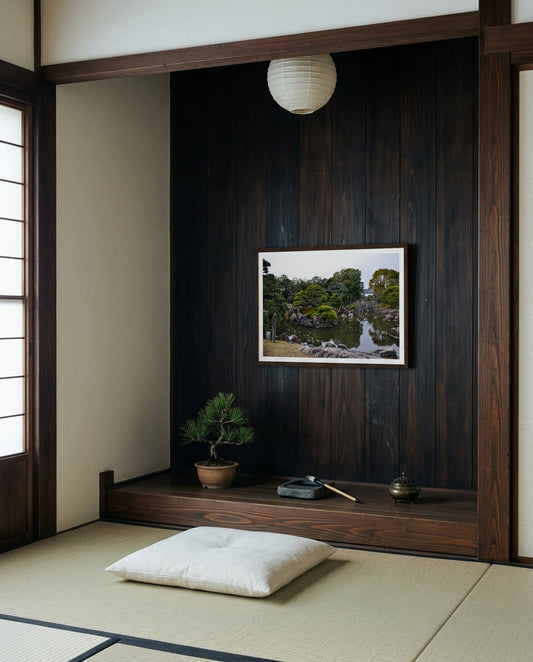 Serenity in Stone: Japanese Garden at Nijo Castle, Kyoto, framed in a Japanese low alcove — tatami floor, low cedar shelf, ceramic vessel, single branch arrangement, dark wood frame. — Two Fat Bunnies.