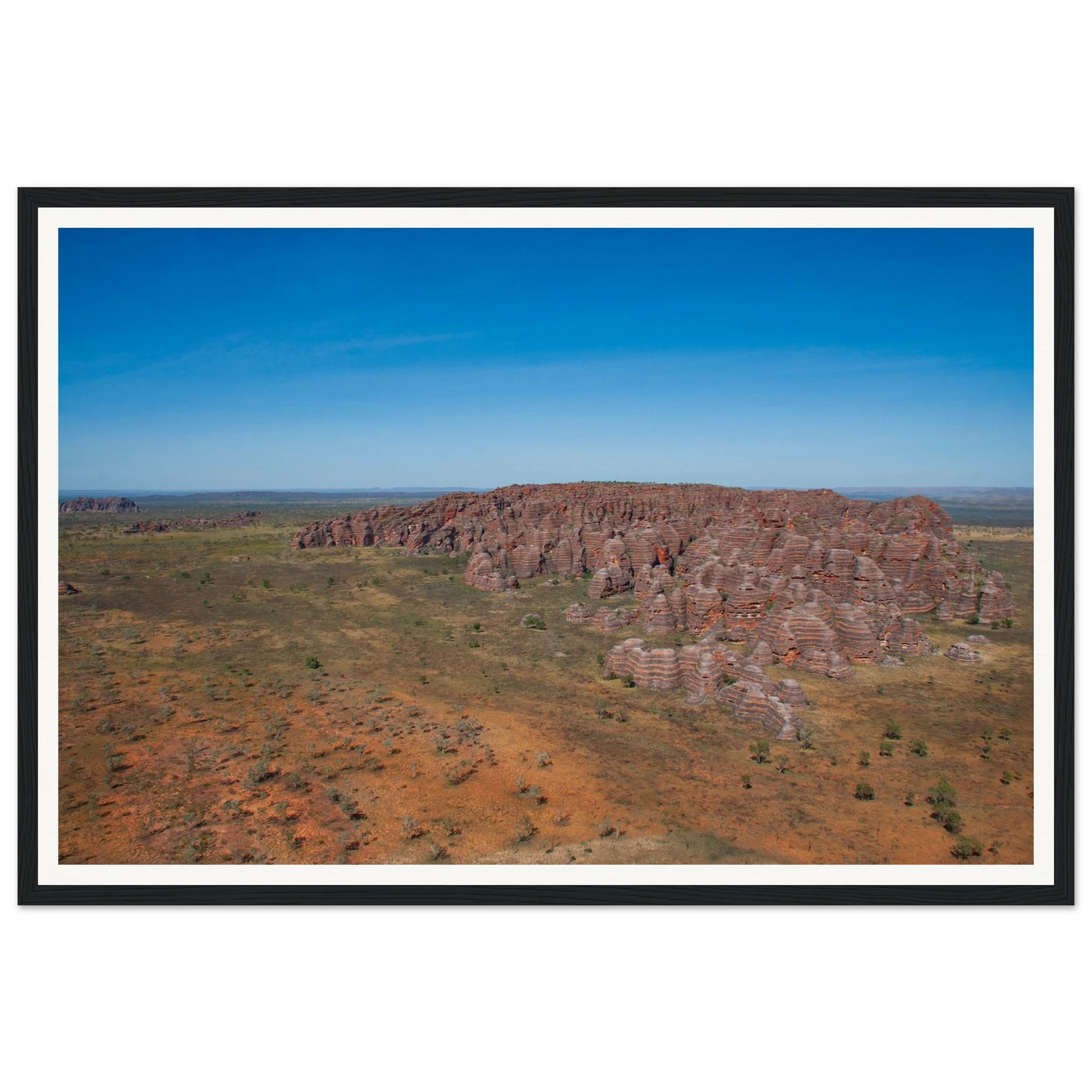 Bungle Bungles From Above — Beehive Domes Aerial Panorama. Fine-art aerial photograph of the iconic striped beehive sandstone domes of the Bungle Bungle range, Purnululu National Park, Western Australia. Framed wooden poster · Made-to-order · Free Australia-wide shipping. — Two Fat Bunnies.