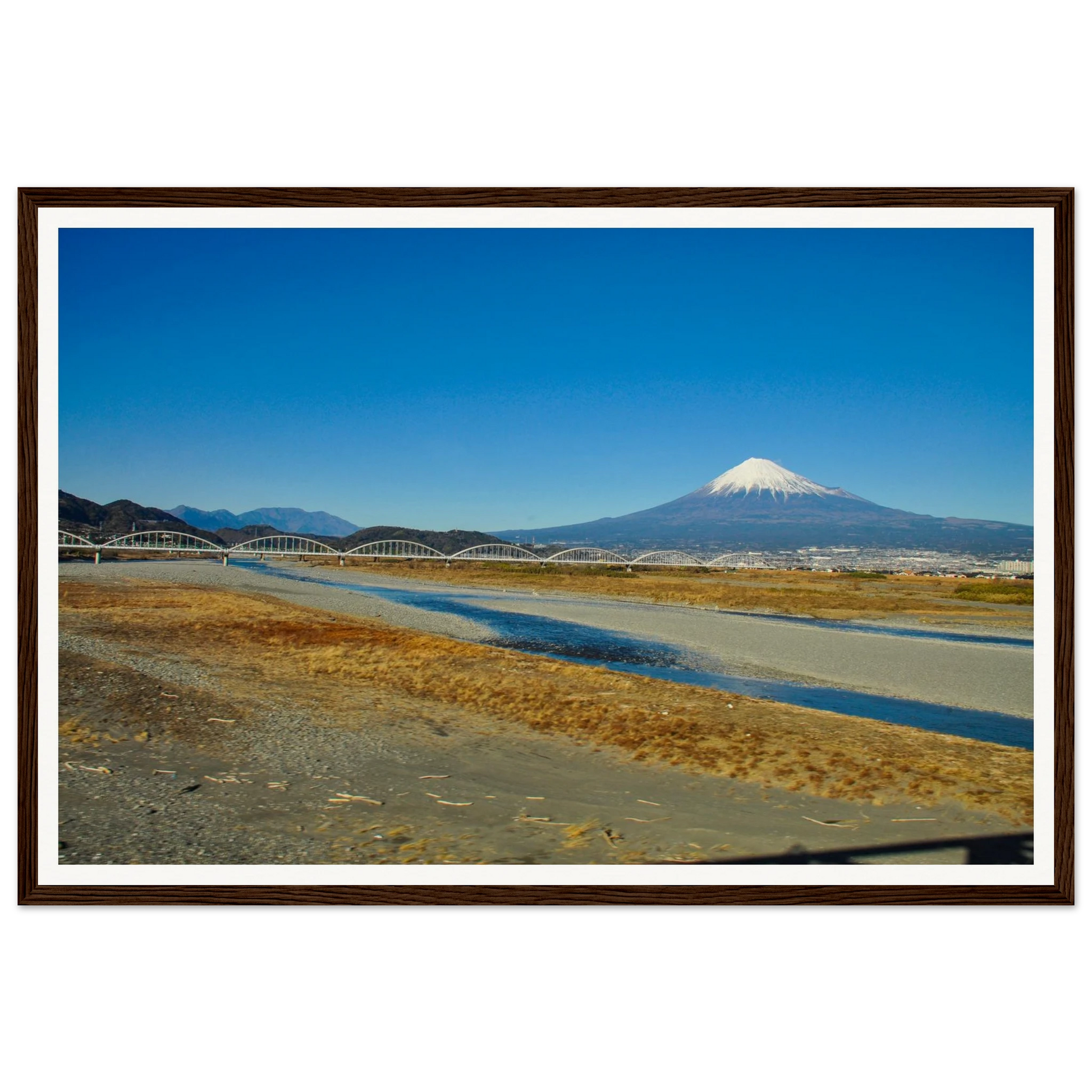 Mt Fuji and the Arched Bridge — Shinkansen View. Fine-art photograph of Mt Fuji from a Shinkansen window with an arched bridge over rivers and grasslands, Japan. Framed wooden poster · Made-to-order · Free Australia-wide shipping. — Two Fat Bunnies.