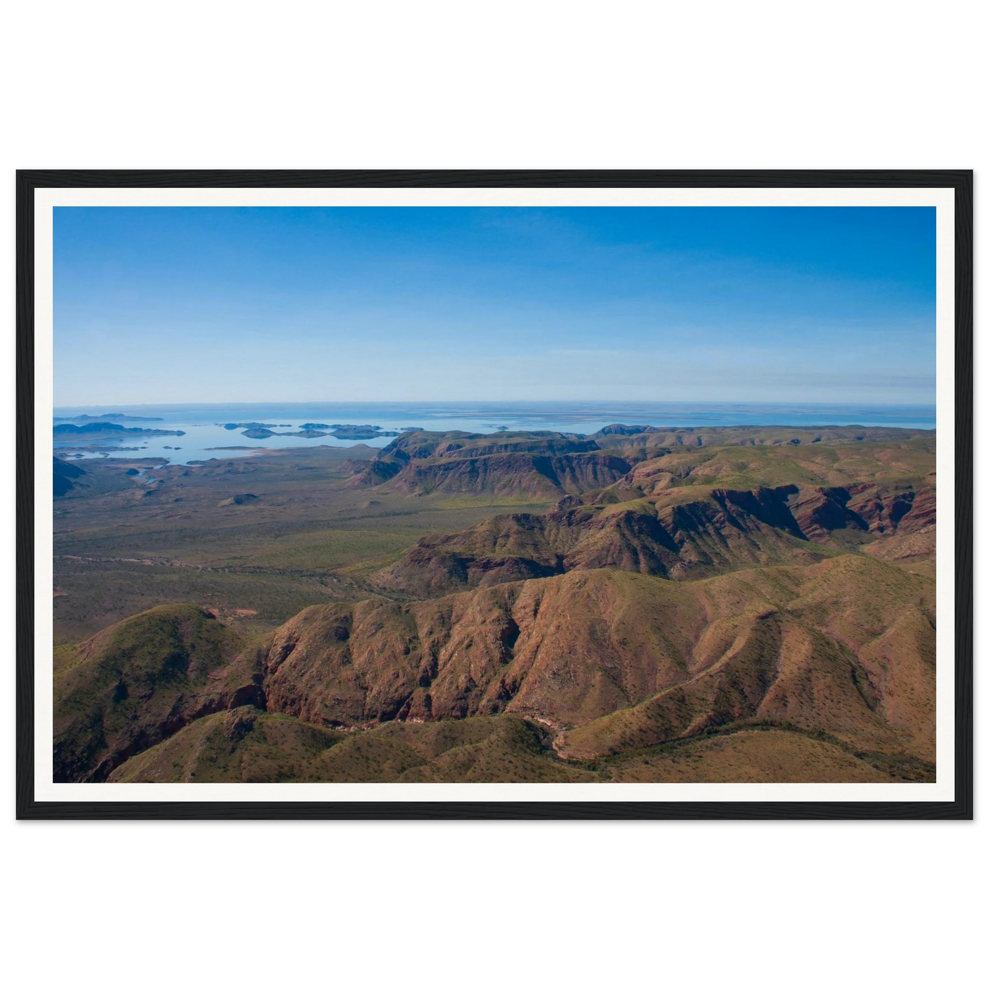 Lake Argyle From Above - Kimberley Aerial Landscape. Fine-art aerial photograph of Lake Argyle and its emerald islands in the East Kimberley region of Western Australia. Framed wooden poster · Made-to-order · Free Australia-wide shipping. — Two Fat Bunnies.