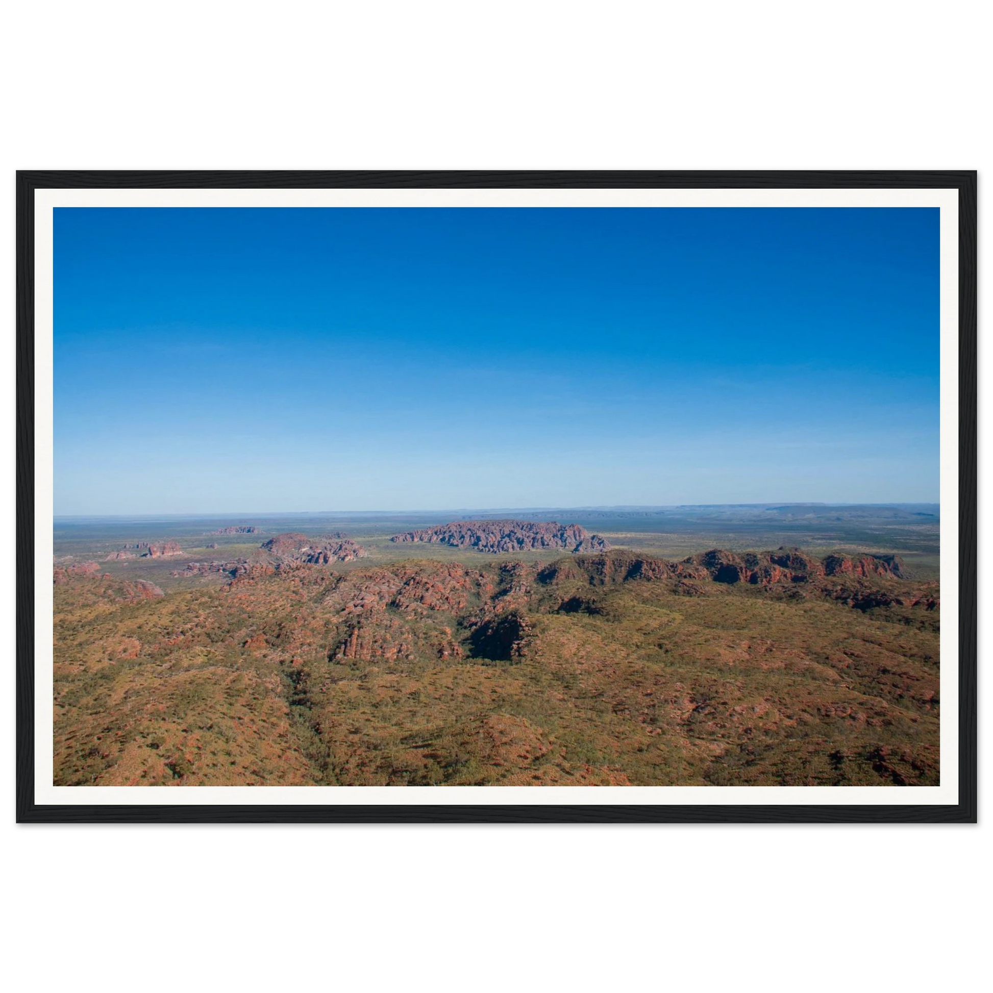 Beehive Domes from Above — Bungle Bungle, Purnululu National Park. Fine-art aerial photograph of the iconic striped sandstone domes of the Bungle Bungle range, a UNESCO World Heritage site in Western Australia's Kimberley region. Framed wooden poster · Made-to-order · Free Australia-wide shipping. — Two Fat Bunnies.