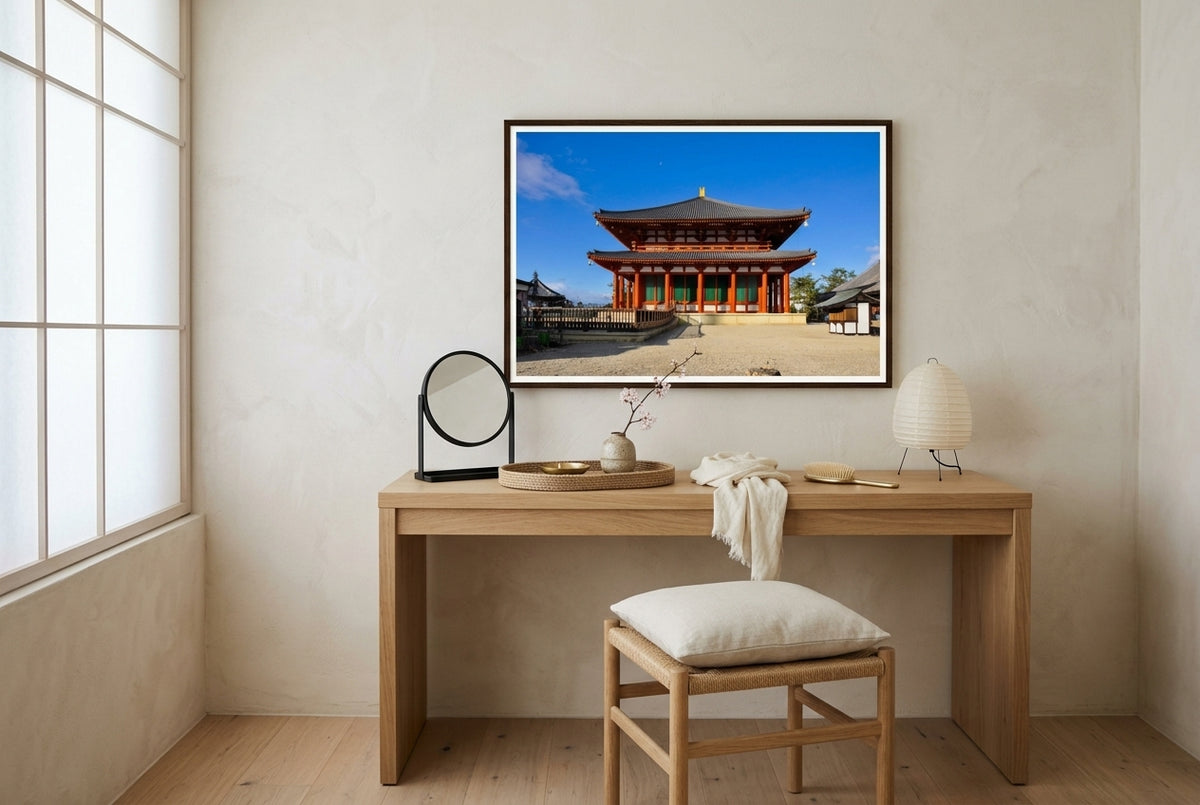 Central Golden Hall at Kōfuku-ji, Nara, framed above a pale oak dressing table in a Japandi master bedroom dressing area — woven jute tray, cherry blossom in vessel, paper-shaded lamp, paper-cord stool, dark wood frame. — Two Fat Bunnies.