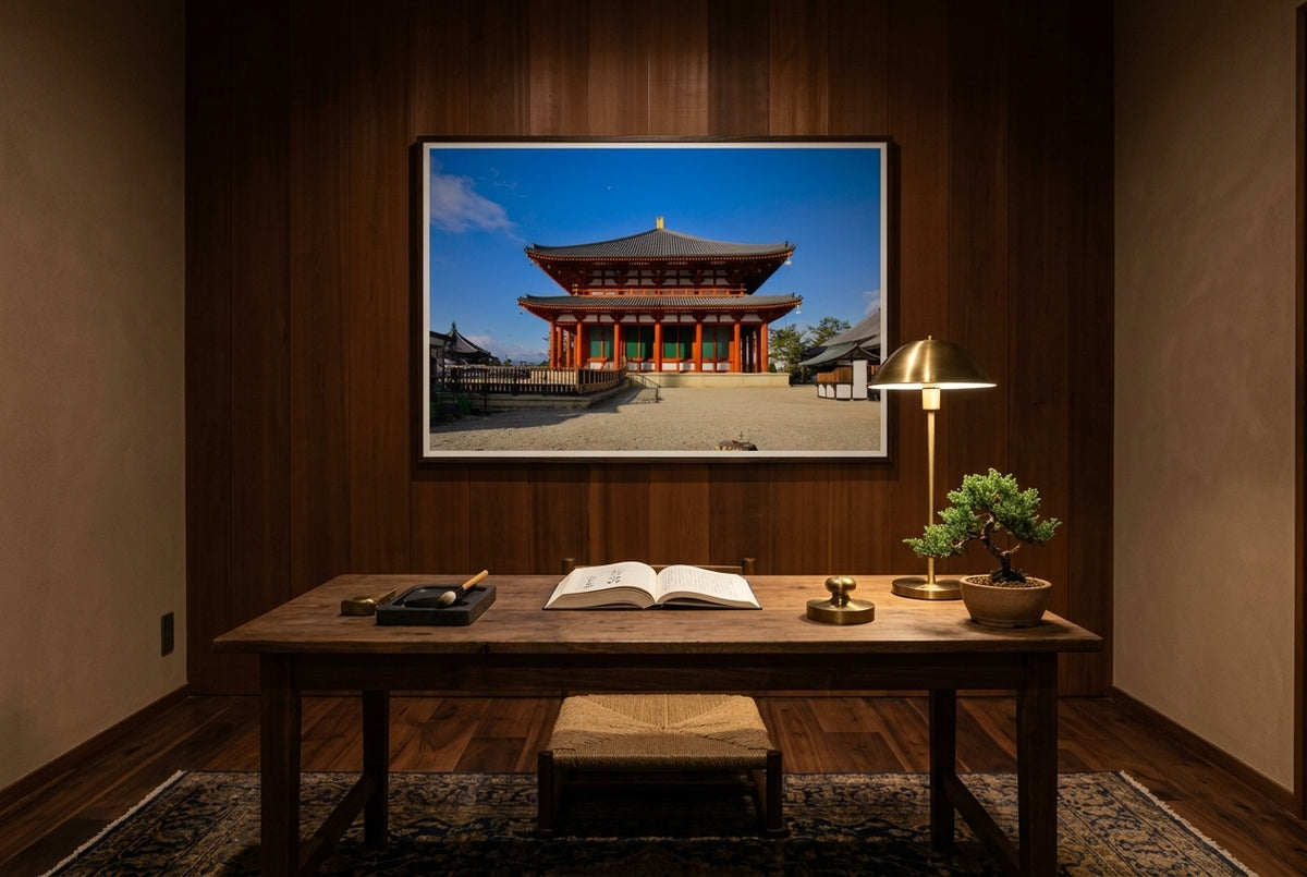 Central Golden Hall at Kōfuku-ji, Nara, framed above an aged walnut writing desk in a Japanese-influenced scholar's study — cedar feature wall, brass reading lamp, ink stone, bonsai juniper, dark wood frame. — Two Fat Bunnies.