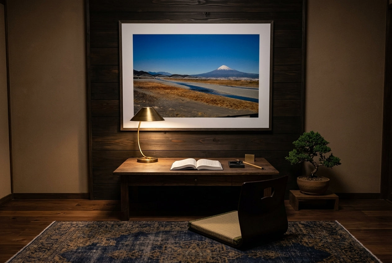 Mt Fuji and the Arched Bridge — Shinkansen View, framed above an aged walnut writing desk in a Japanese-influenced scholar study — cedar feature wall, brass-shaded reading lamp, ink stone, bonsai juniper, dark wood frame. — Two Fat Bunnies.