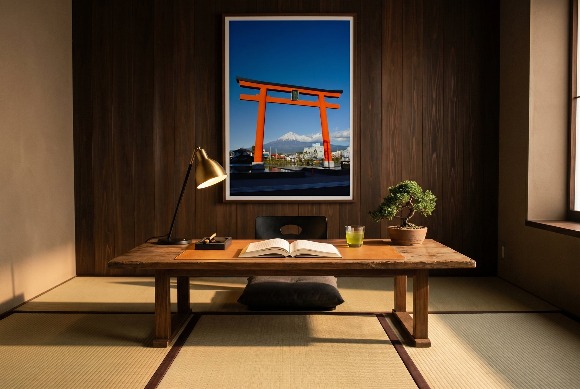 Mt Fuji Through the Torii Gate – Shizuoka, framed above an aged walnut writing desk in a Tokyo apartment-inspired study — dark cedar feature wall, tatami, brass desk lamp, ink stone and brush, bonsai juniper, dark wood frame. — Two Fat Bunnies.