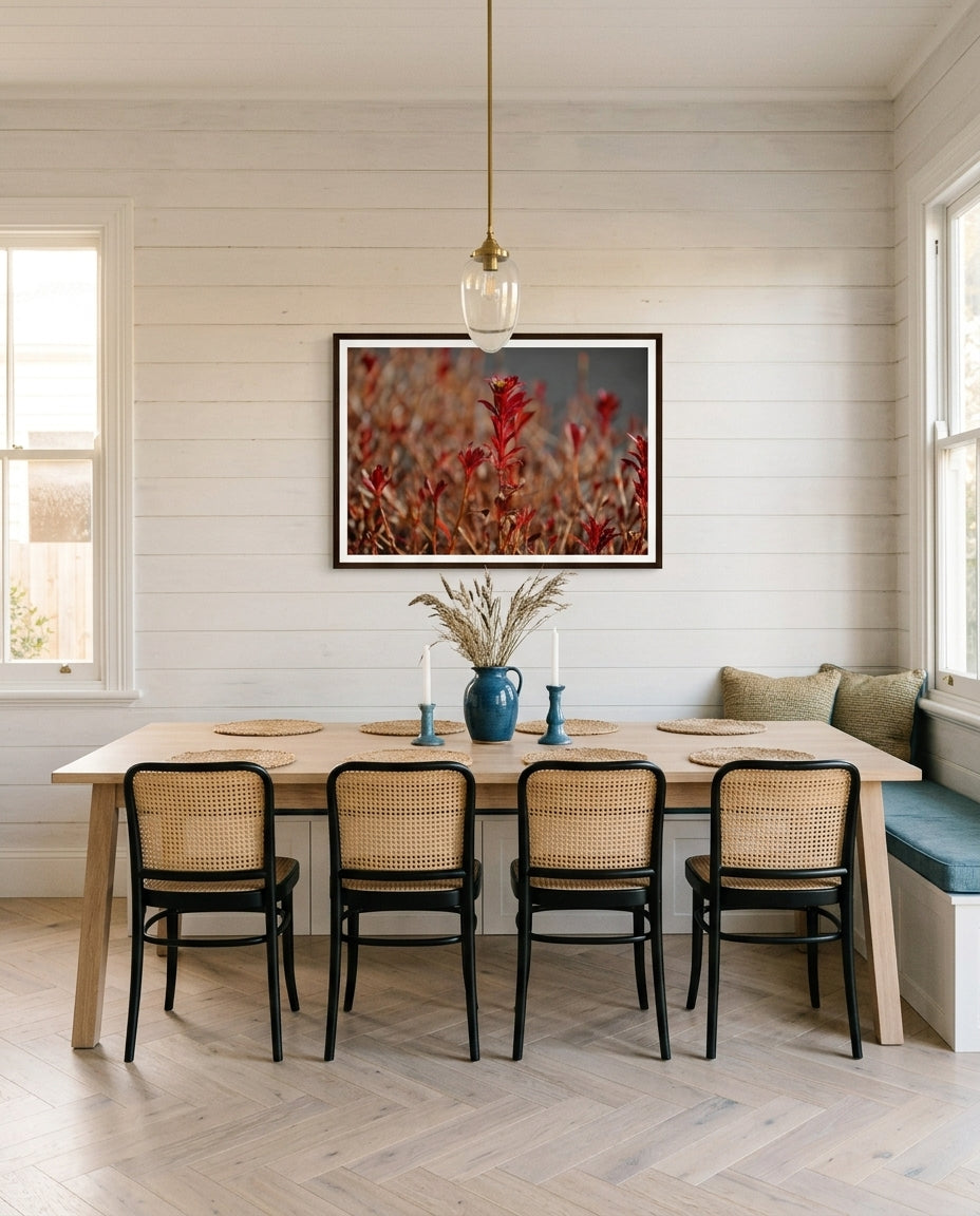Radiant Red Bloom – Tokyo Roadside Flower, framed above a timber dining sideboard in a weatherboard cottage dining room — pale linen runner, ceramic jug with greenery, woven pendant, dark wood frame. — Two Fat Bunnies.