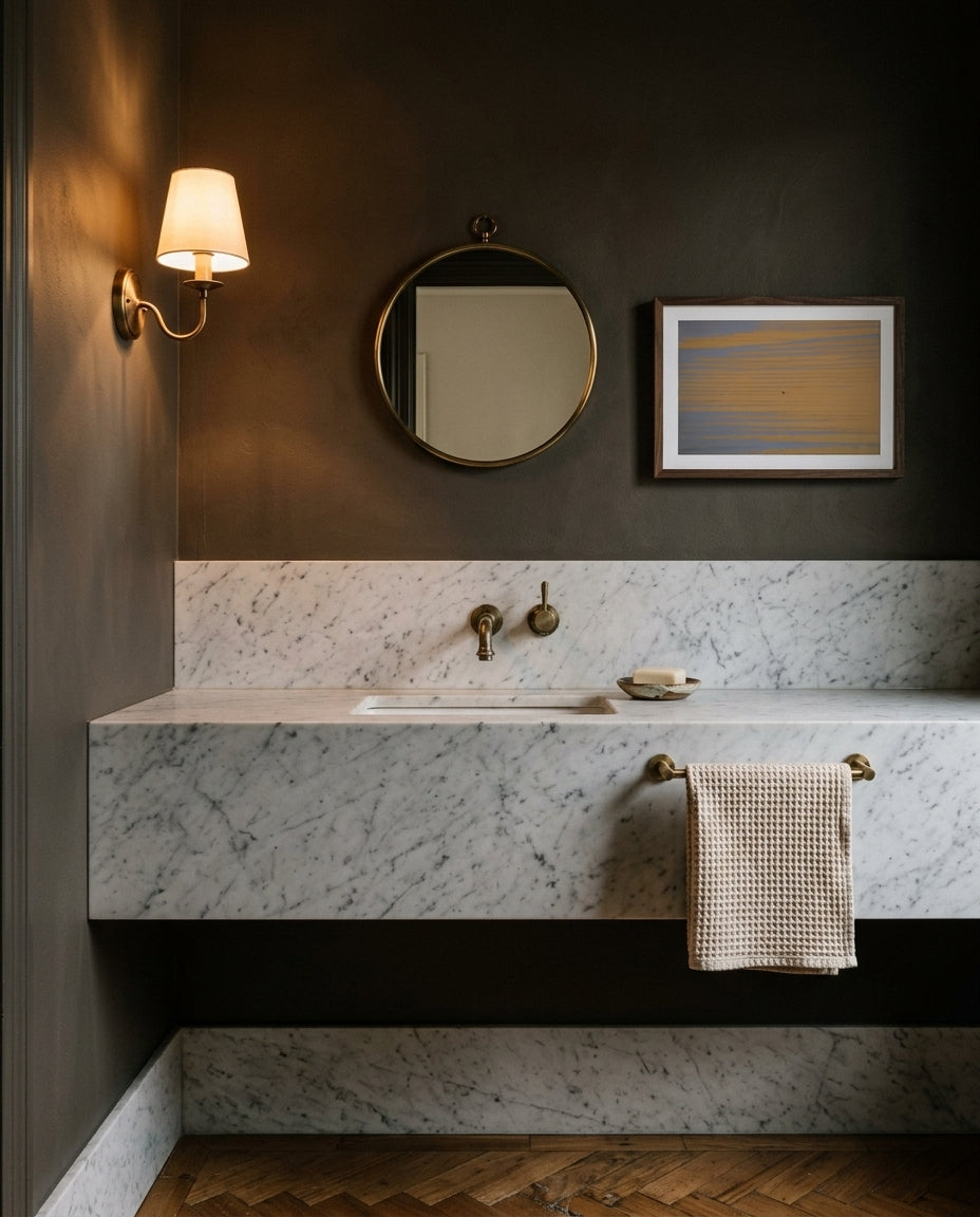 Solitude at Merimbula, framed in a heritage powder room — pedestal basin, brass tapware, panelled wainscoting, dark wood frame. — Two Fat Bunnies.