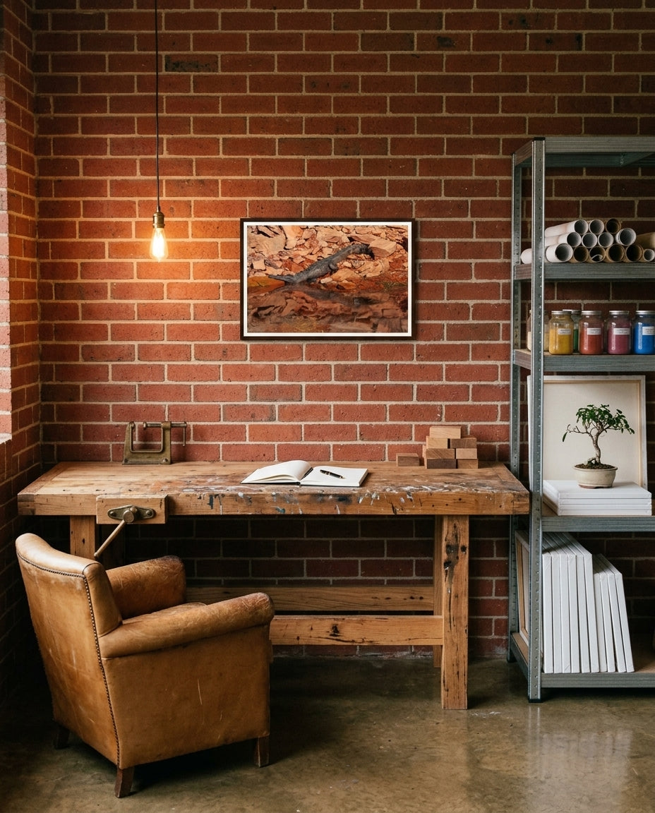 Sunlit Stillness — Freshwater Crocodile, Lake Argyle, framed in a creative garage workshop — recycled-timber bench, jars of fixings, leather apron, dark wood frame. — Two Fat Bunnies.