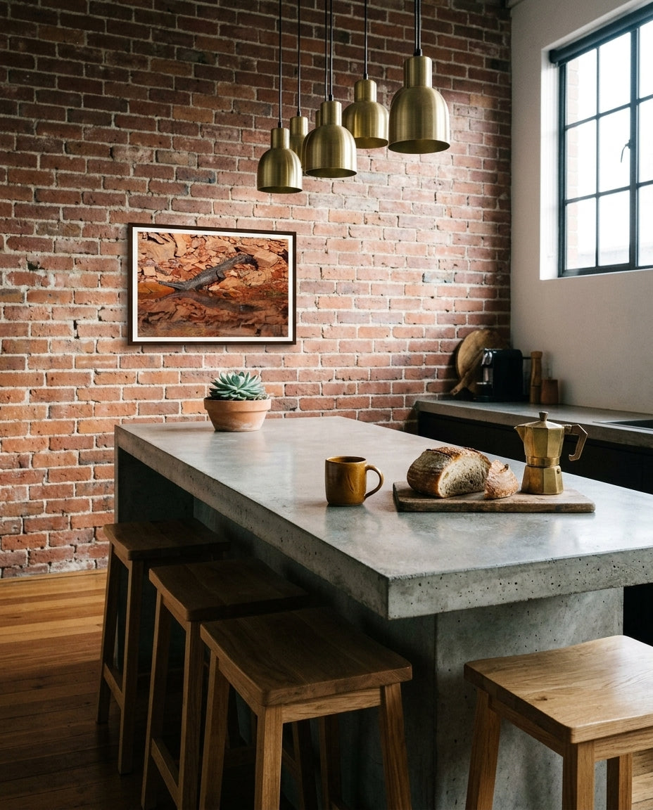 Sunlit Stillness — Freshwater Crocodile, Lake Argyle, framed above an urban loft kitchen island — concrete benchtop, oak stools, brass pendant, dark wood frame. — Two Fat Bunnies.