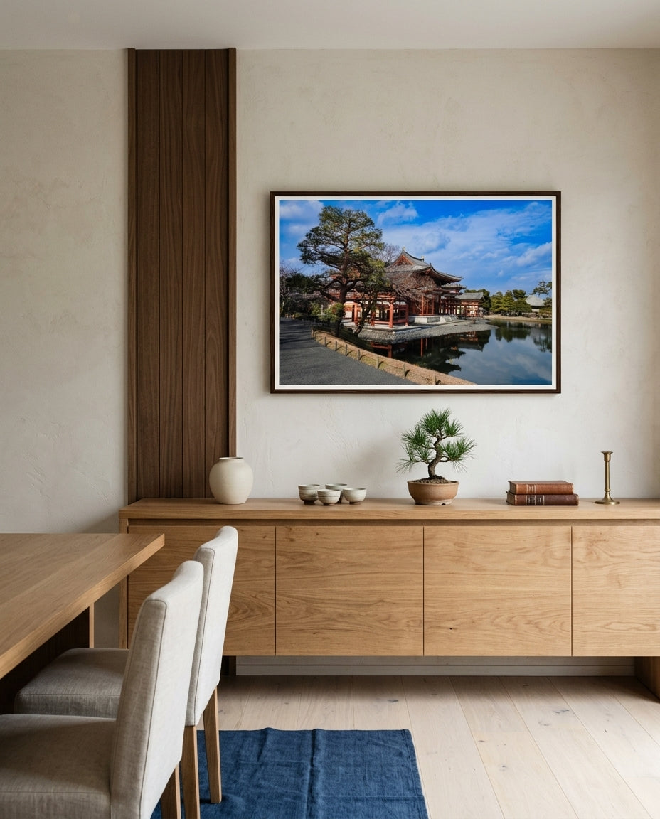 Timeless Serenity: View of the Phoenix Hall, Byōdō-in, framed above a credenza in a Japandi dining room — limewash wall, oak table, linen seating, ceramic vase, dark wood frame. — Two Fat Bunnies.
