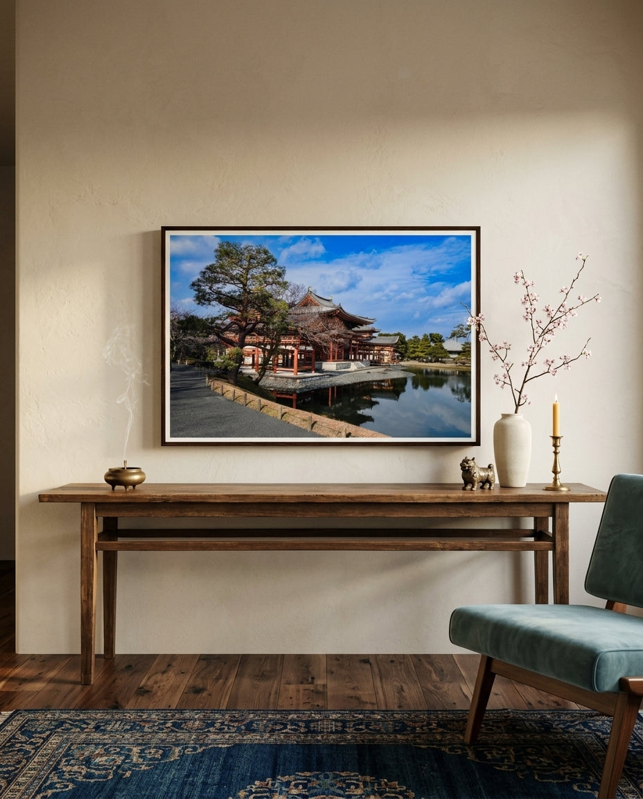Timeless Serenity: View of the Phoenix Hall, Byōdō-in, framed in a Japanese-fusion drawing room — low oak coffee table, linen sofa, paper lantern, ikebana branch, dark wood frame. — Two Fat Bunnies.