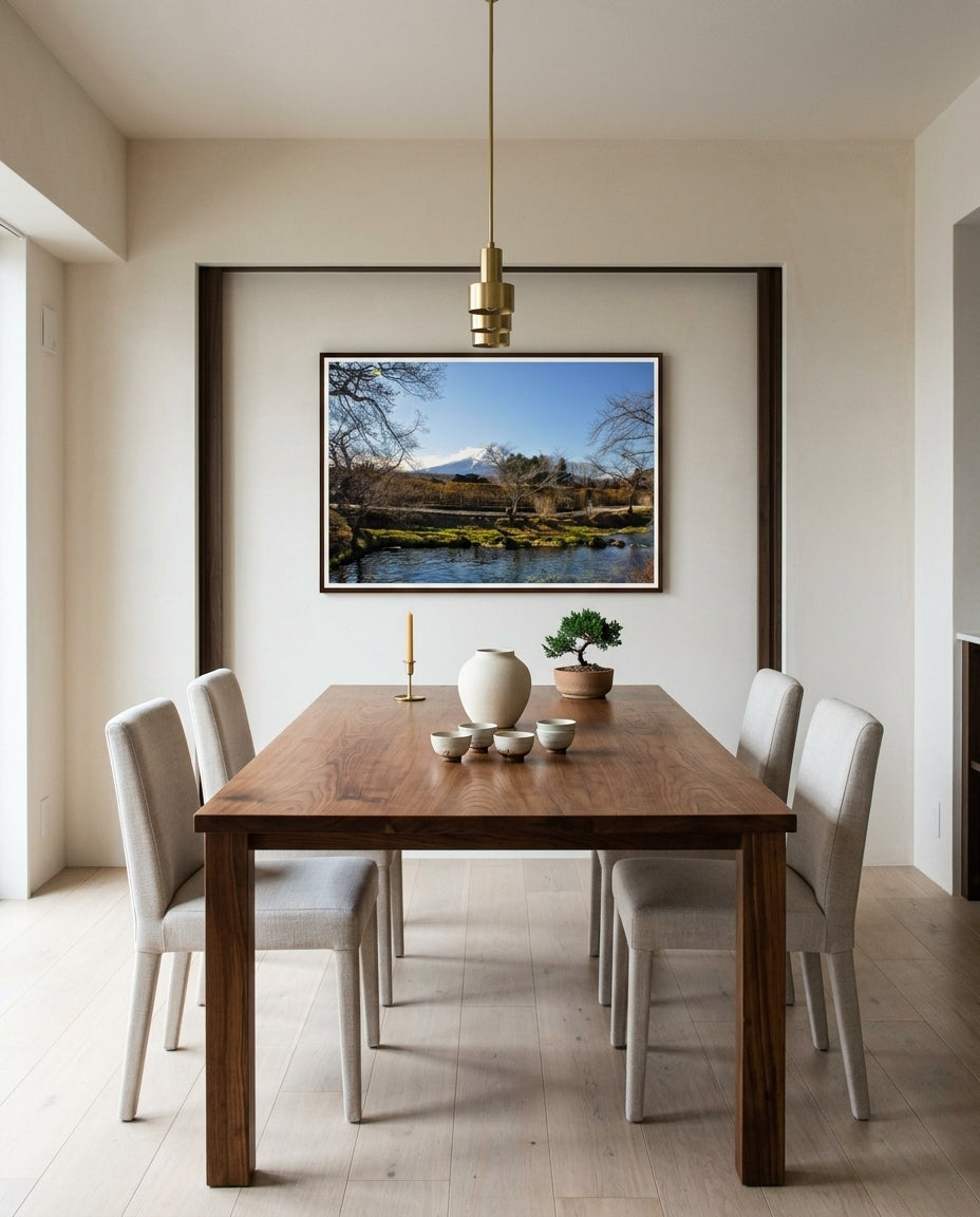 Tranquil Reflections: Mt Fuji over Oshino Hakkai Village, framed above a pale-oak dining sideboard in a Tokyo apartment dining room — linen runner, ceramic vessel, simple branch arrangement, dark wood frame. — Two Fat Bunnies.